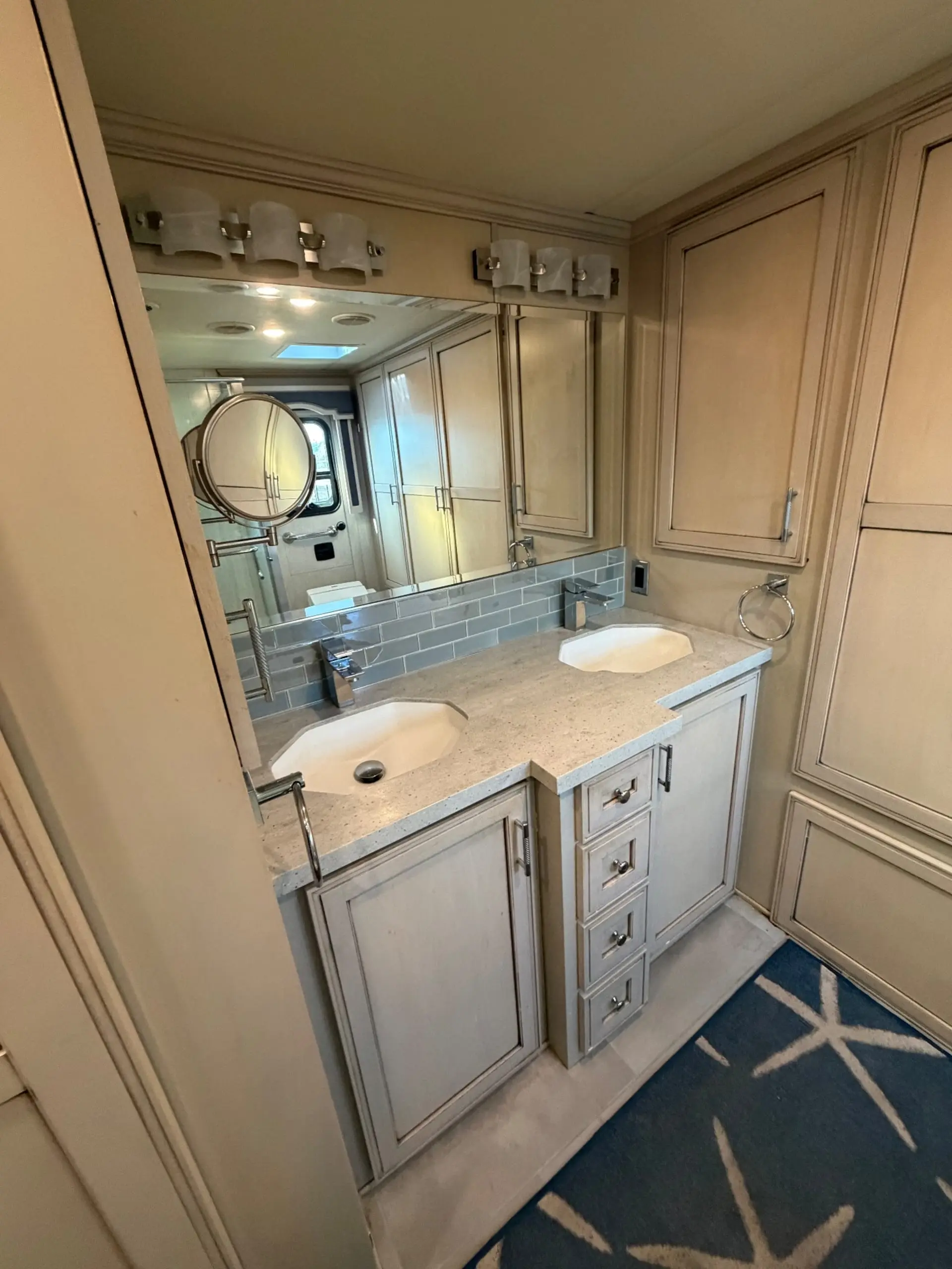 Dual vanity in full-width bathroom