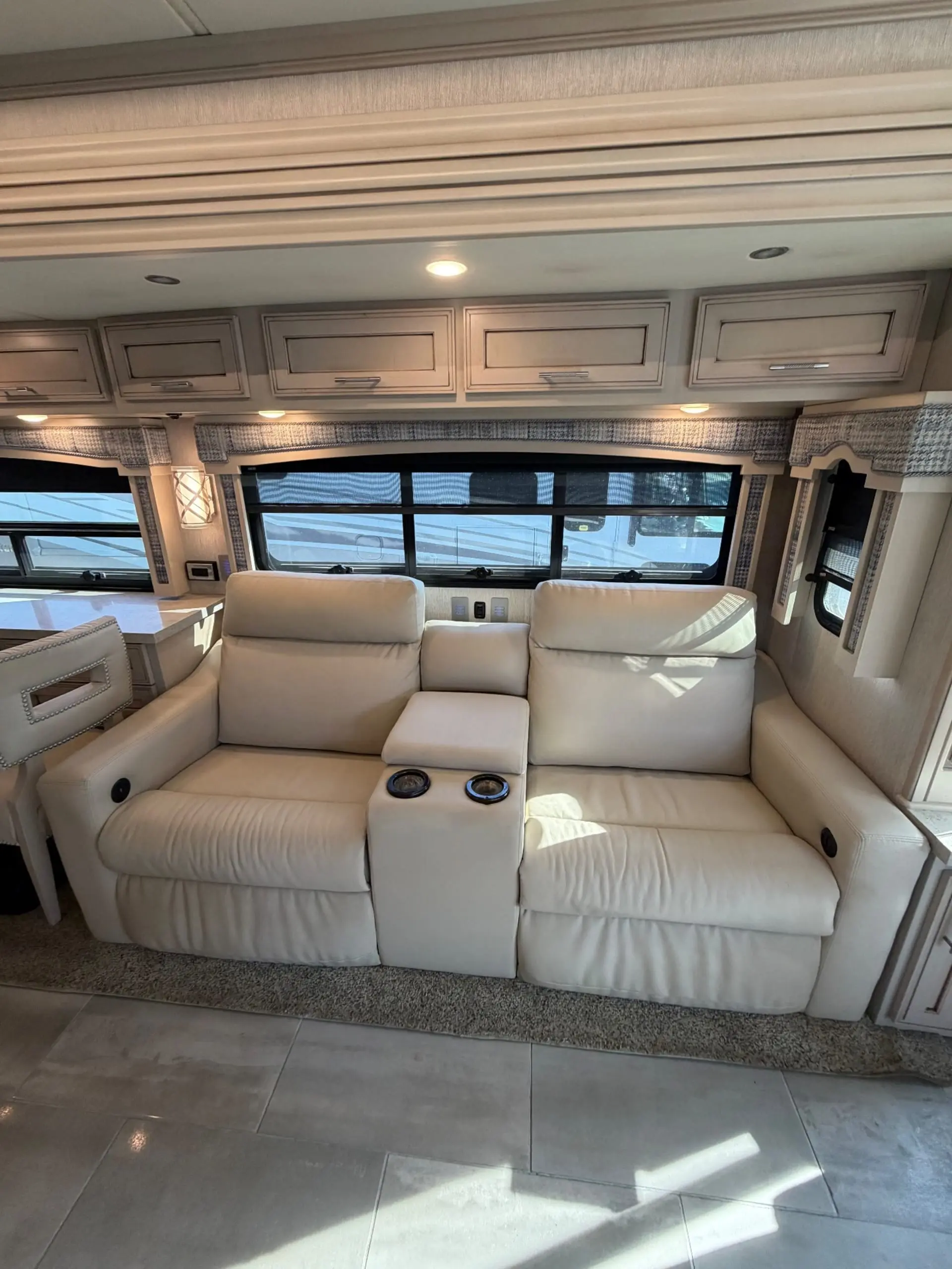 Recliners facing couch and TV on lift