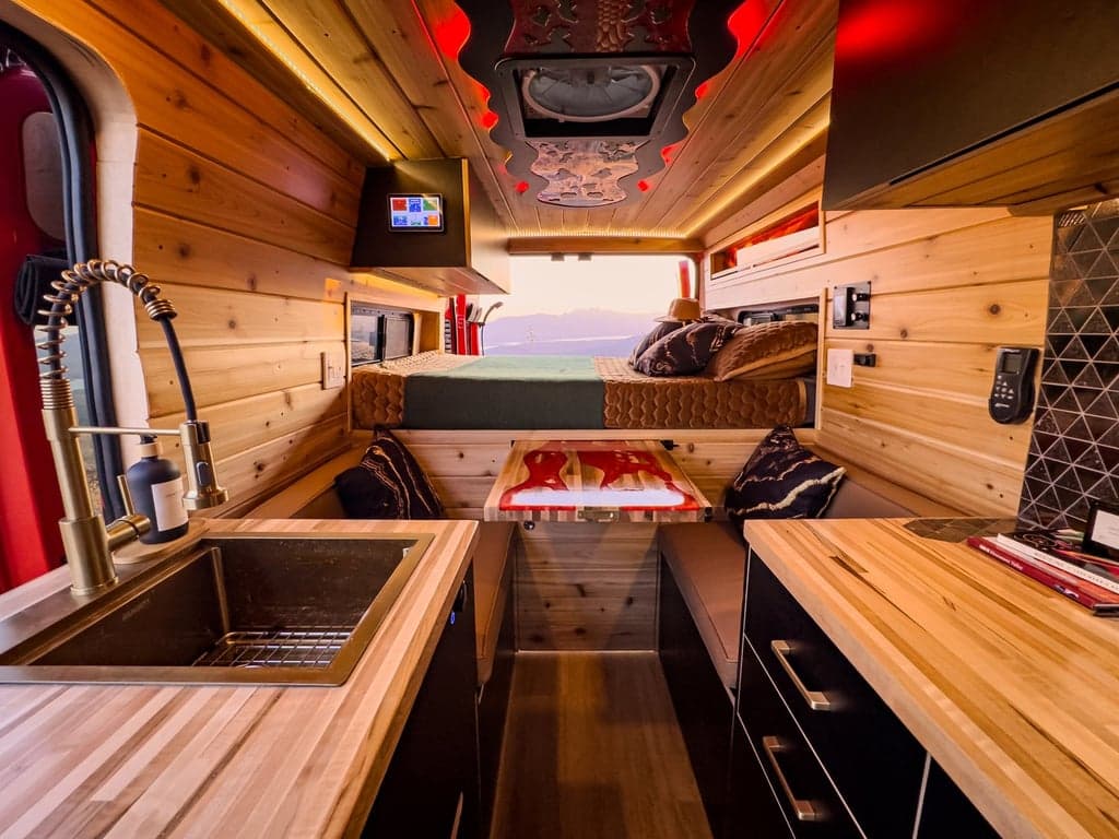 The table slides out from beneath the bed to form a dinette