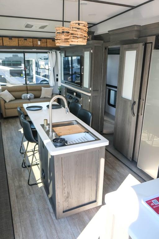 Kitchen island with bunkhouse in slideout in the background