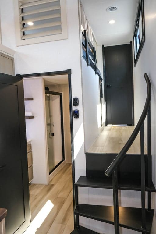 Staircase leading to the main bedroom and a loft on the way