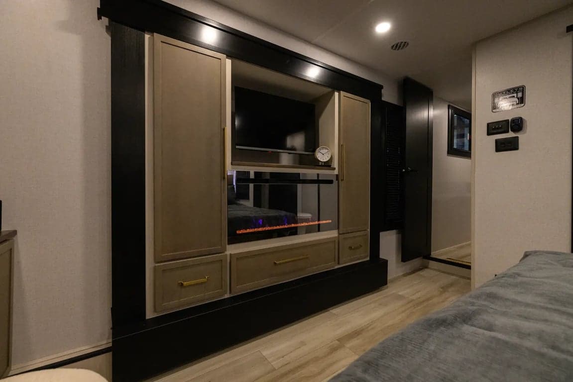 Entertainment center and fireplace in front bedroom