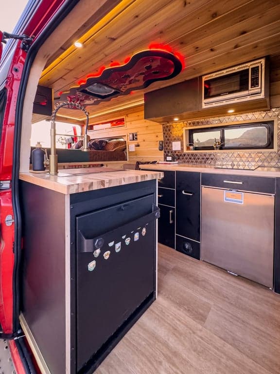 Tetravan shower folds out (like a dishwasher) and water drains into the gray tank while keeping the camper dry