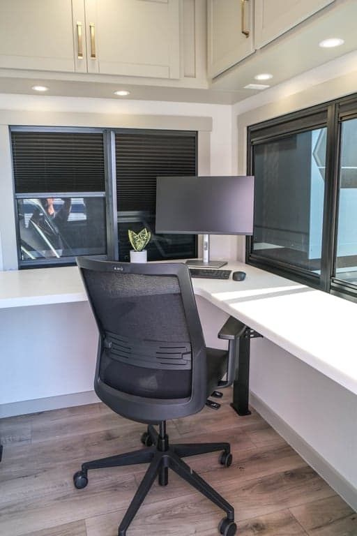 Rear office with large, adjustable desk