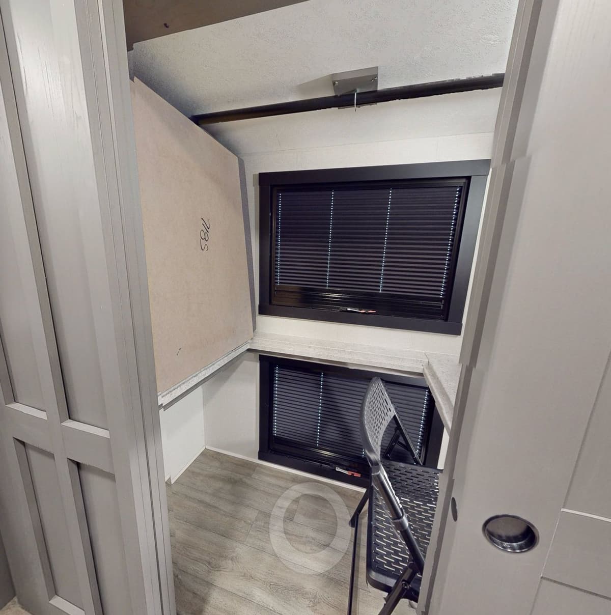 Bunk-turned-desk in the Coachmen Pursuit 31ES